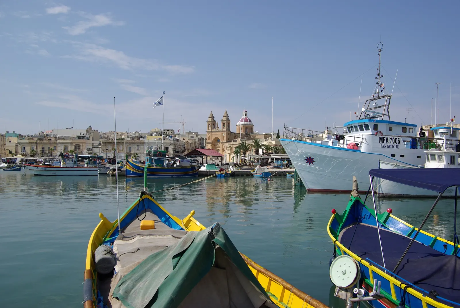 Painted luzzu boats in Marsaxlokk harbour