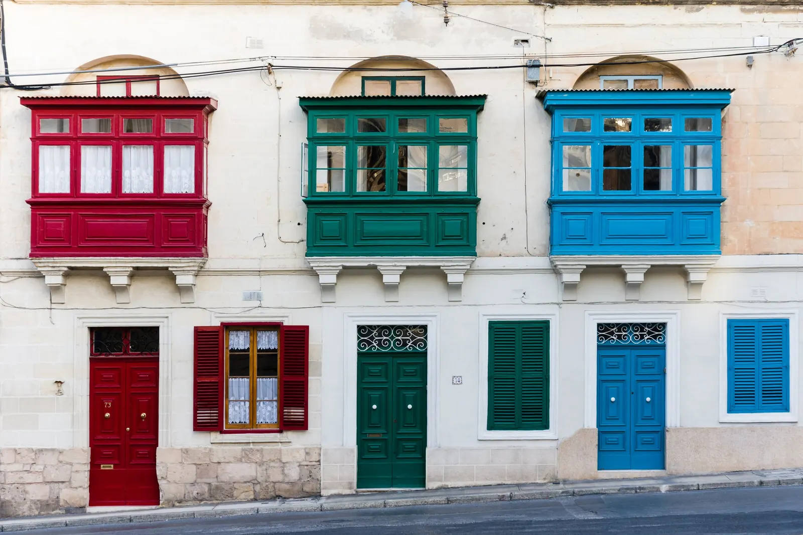 Painted timber balconies on a Sliema townhouse