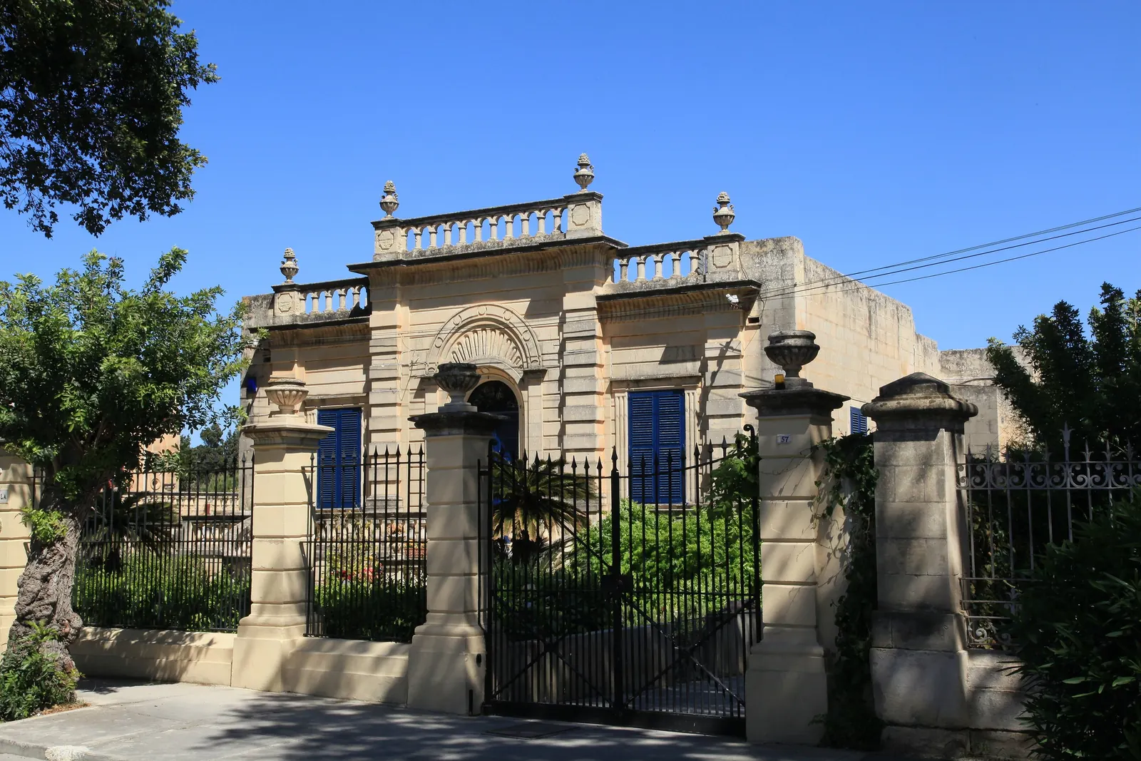 A villa gate on a quiet street in Attard