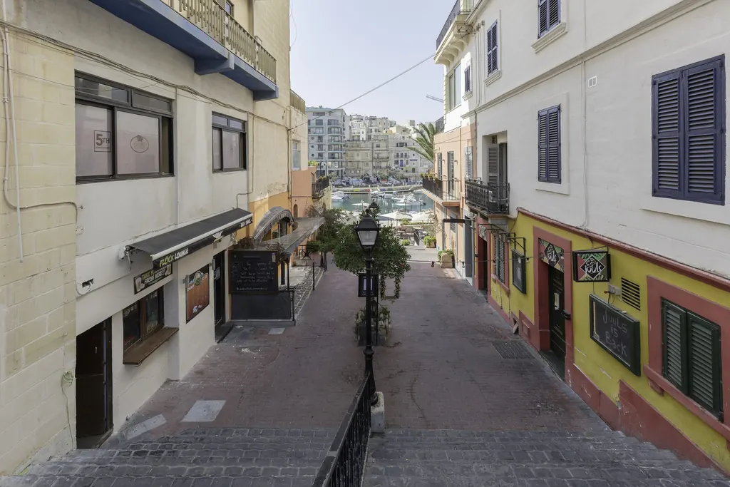 A street stepping down to the sea in St Julian's